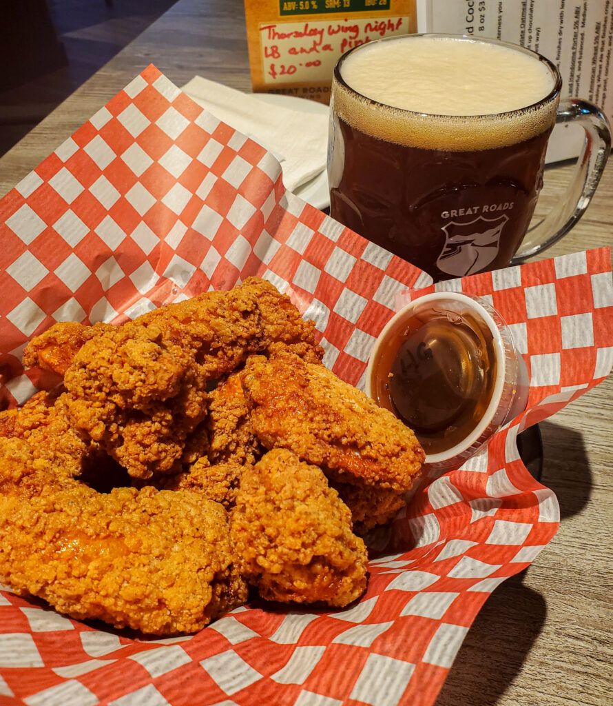 A picture of a plate of chicken tenders and a glass of beer at Great Roads Brewing Lower Sackville